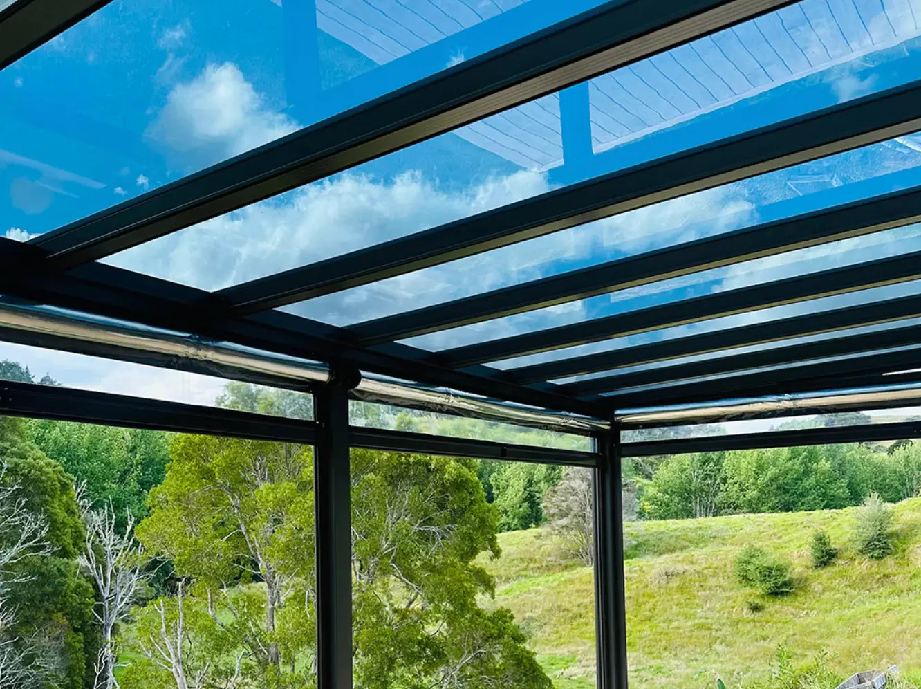 Premium Luxishade custom outdoor canopy structure extending a residential living space.