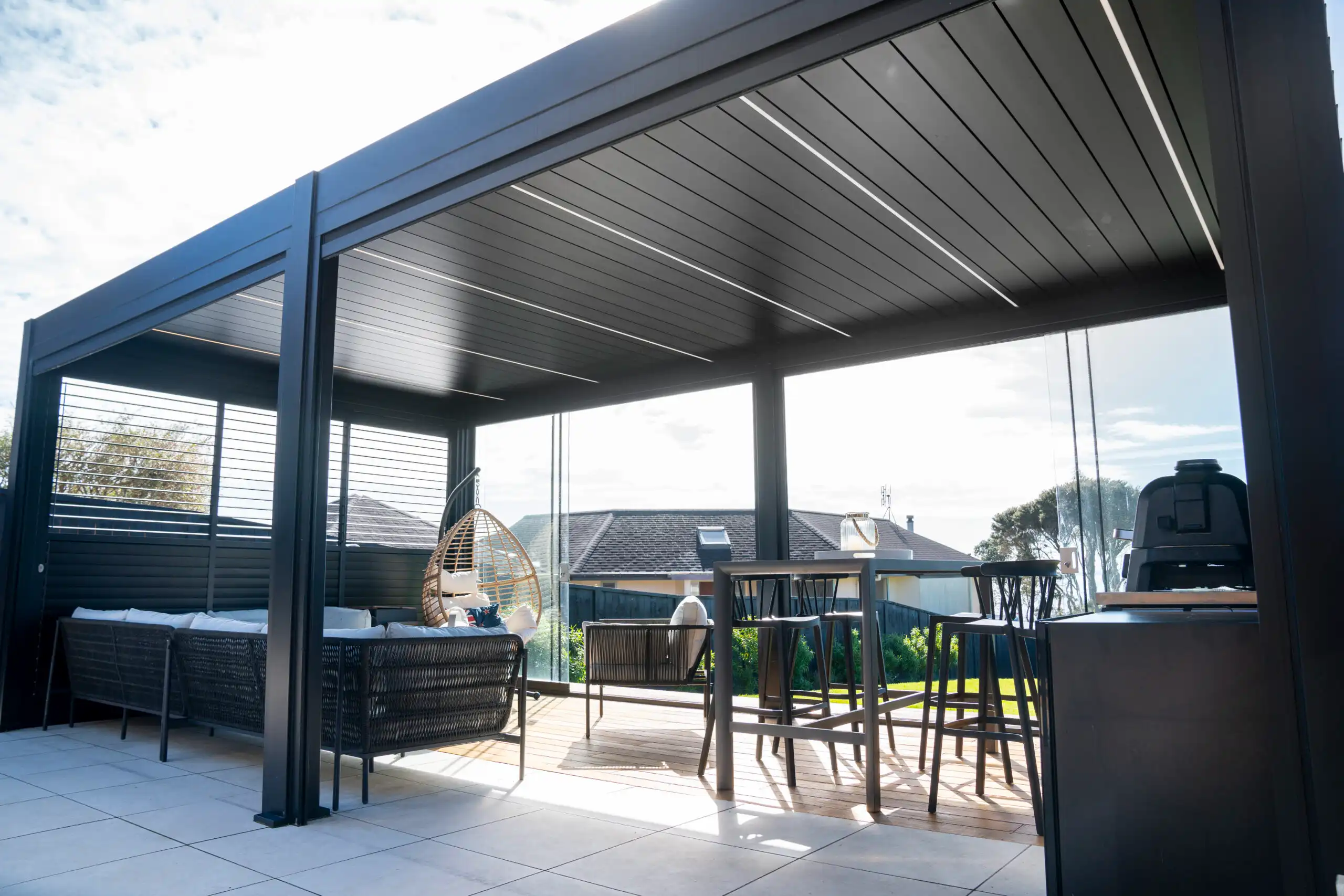 Motorised Deluxe Louvre aluminium roof system with smart weather sensors.