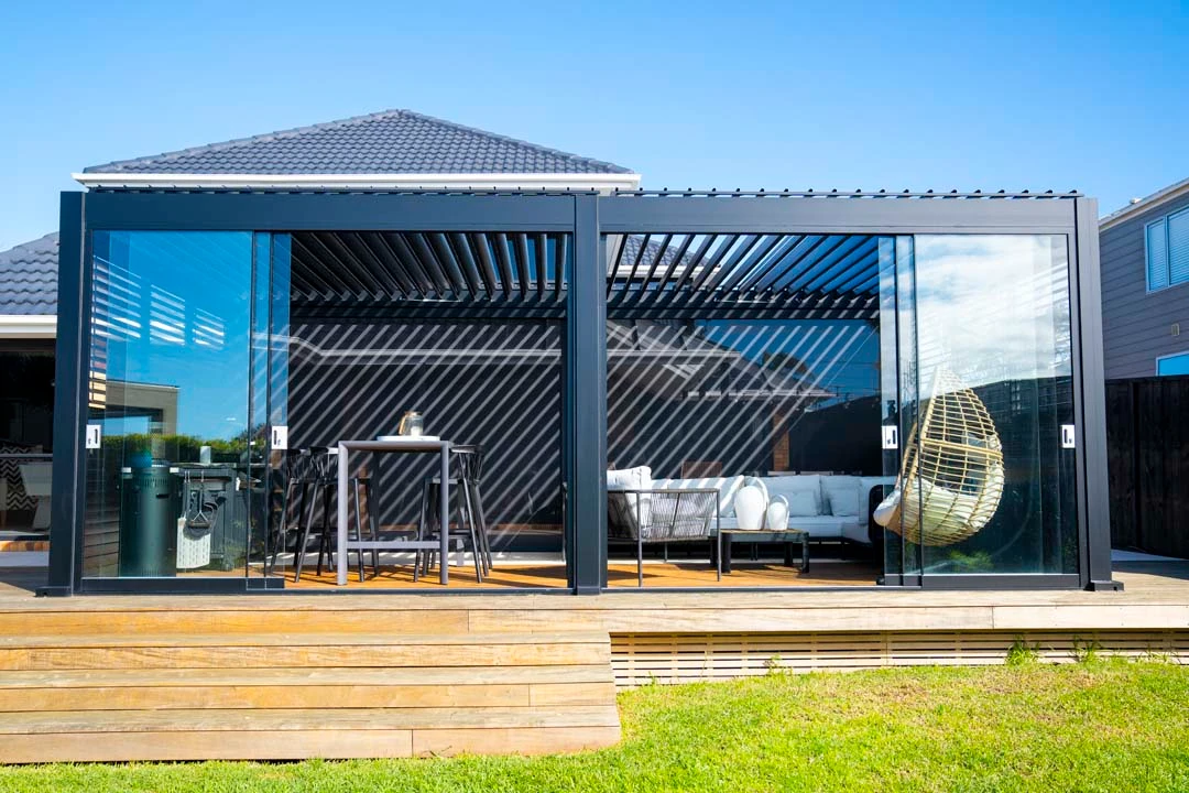 Sleek residential shading addition providing high UV protection over patio furniture.