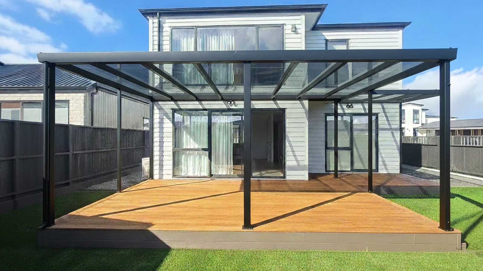 Attached architectural straight pergola structure with heavy-duty aluminum framing and a protective polycarbonate roof shield.